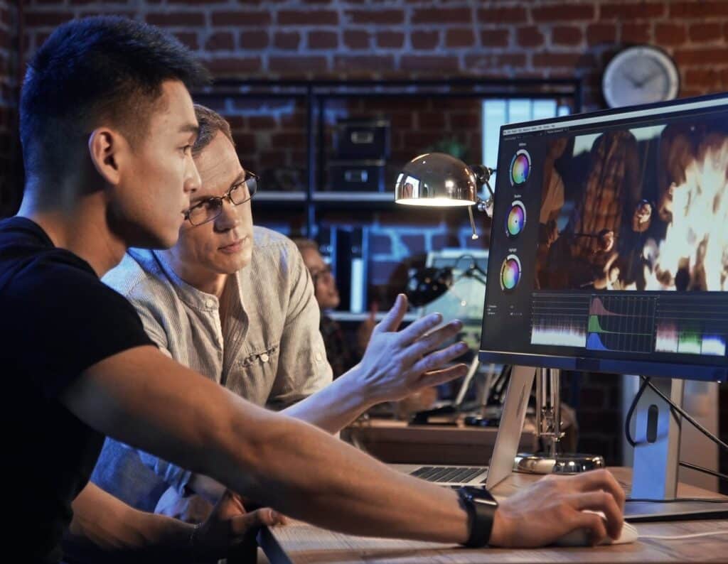People are working on video edit of documentary