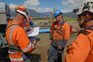 Construction engineers discussion with cor auditors at construction site or building site of highrise building with Surveying for making contour plans is a graphical representation of the lay in land.