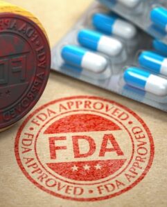 FDA approved concept. Rubber stamp with FDA and pills on craft paper. 3d illustration