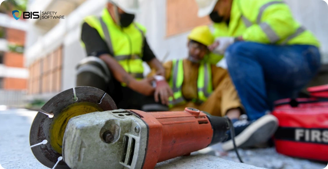 Injured construction worker receives first aid.