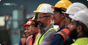 Diverse team of workers engaged in a safety briefing, reflecting collective responsibility in the evolving landscape of workplace safety.