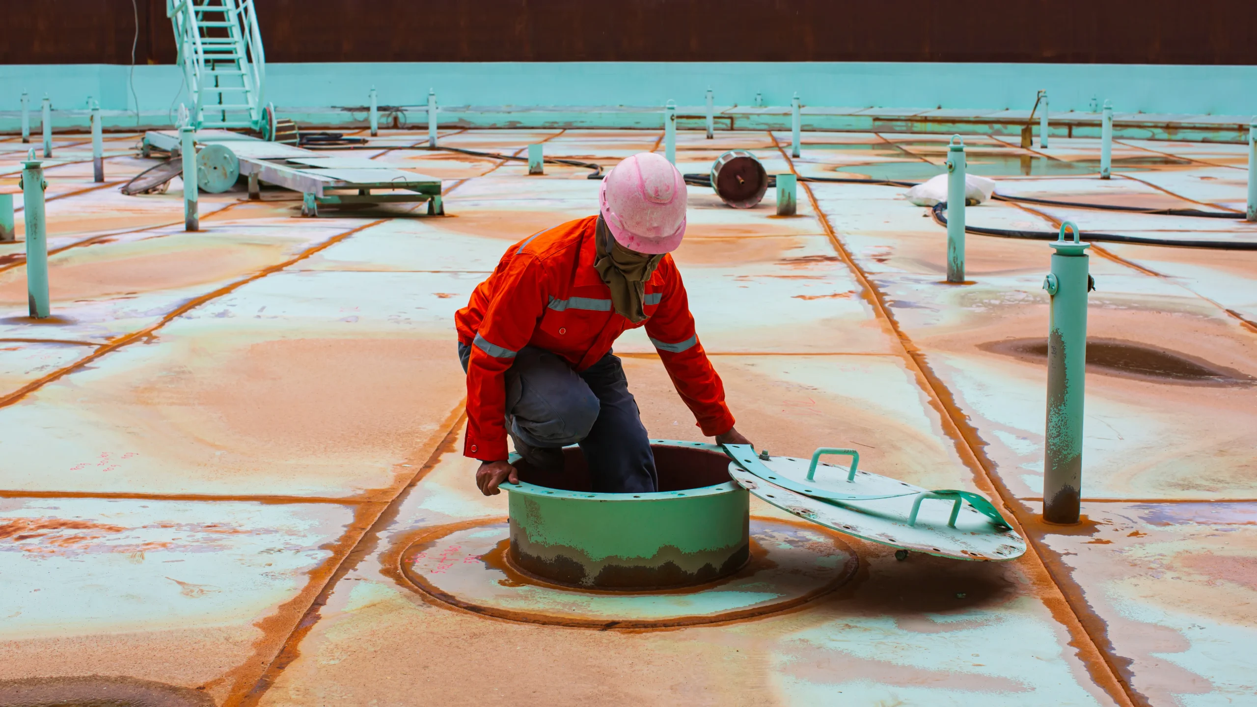 Confined space safety inspection inside an enclosed vessel.