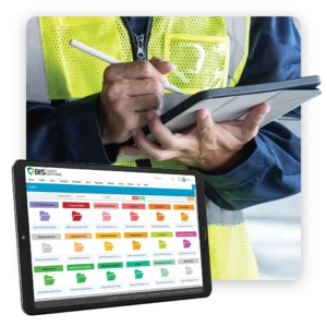 Worker completing safety documentation on a tablet with a document management dashboard on screen