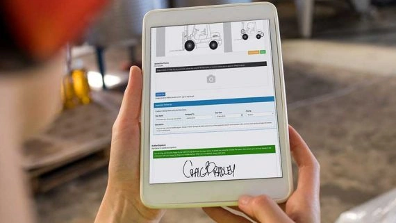 Digital form for equipment management tablet woman hard hat