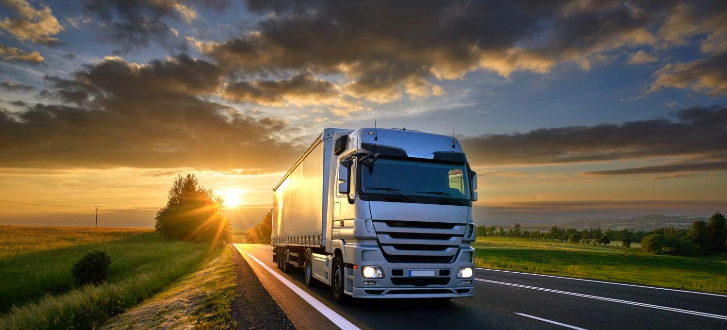 Transport Truckon Road With Sunset
